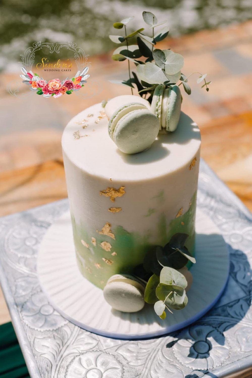 White cake with fresh greenery