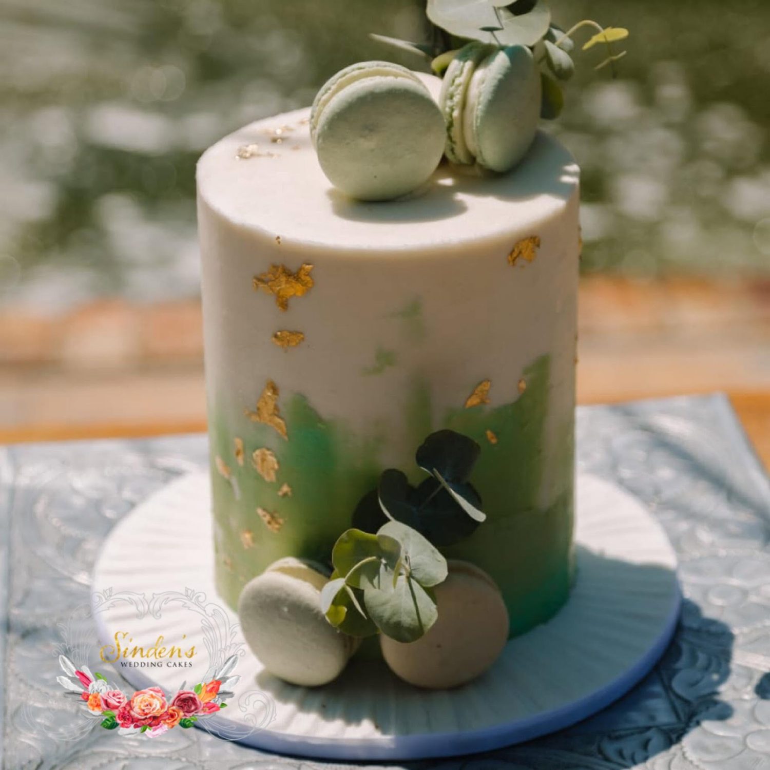White cake with botanical greenery