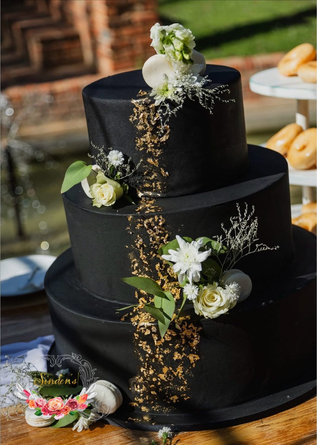 Black cake with cascading florals