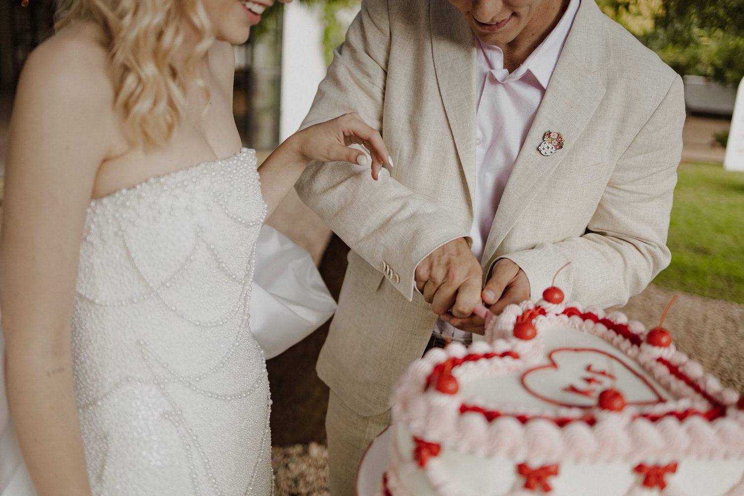 A cake being finished by hand