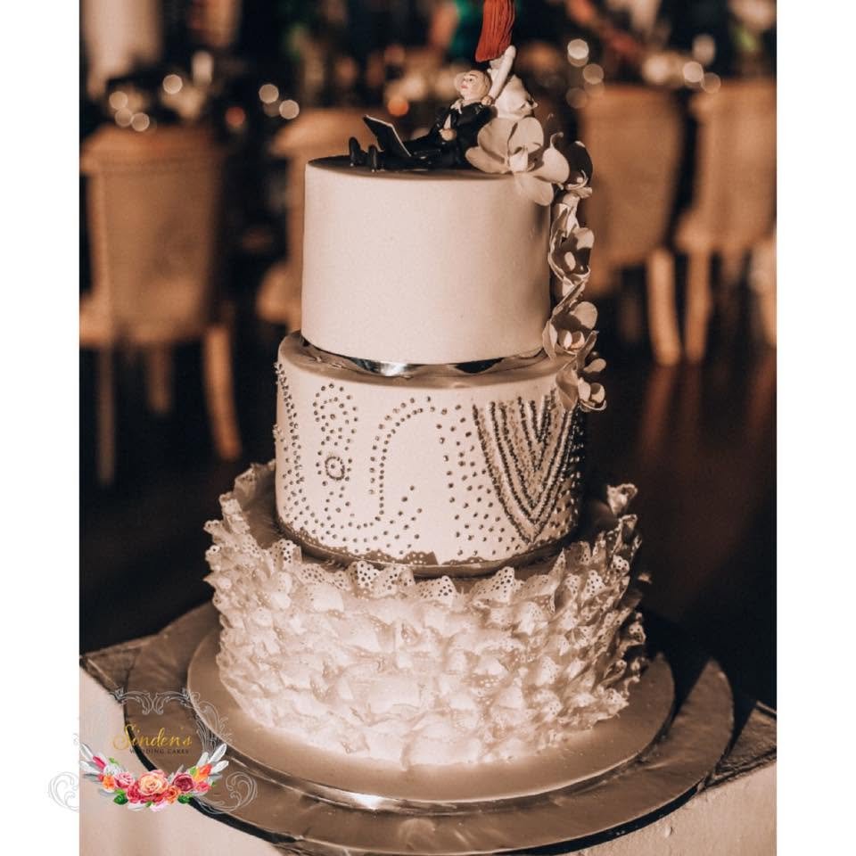 An elegant multi-tier wedding cake decorated with florals